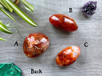 Pictured are various polished carnelian stones.