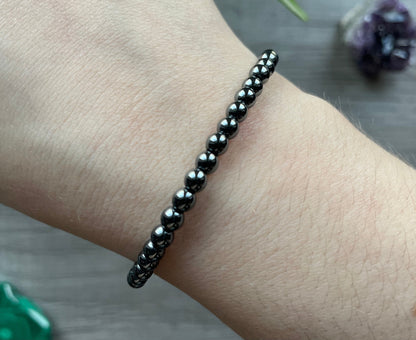 Pictured is a hematite bead bracelet.