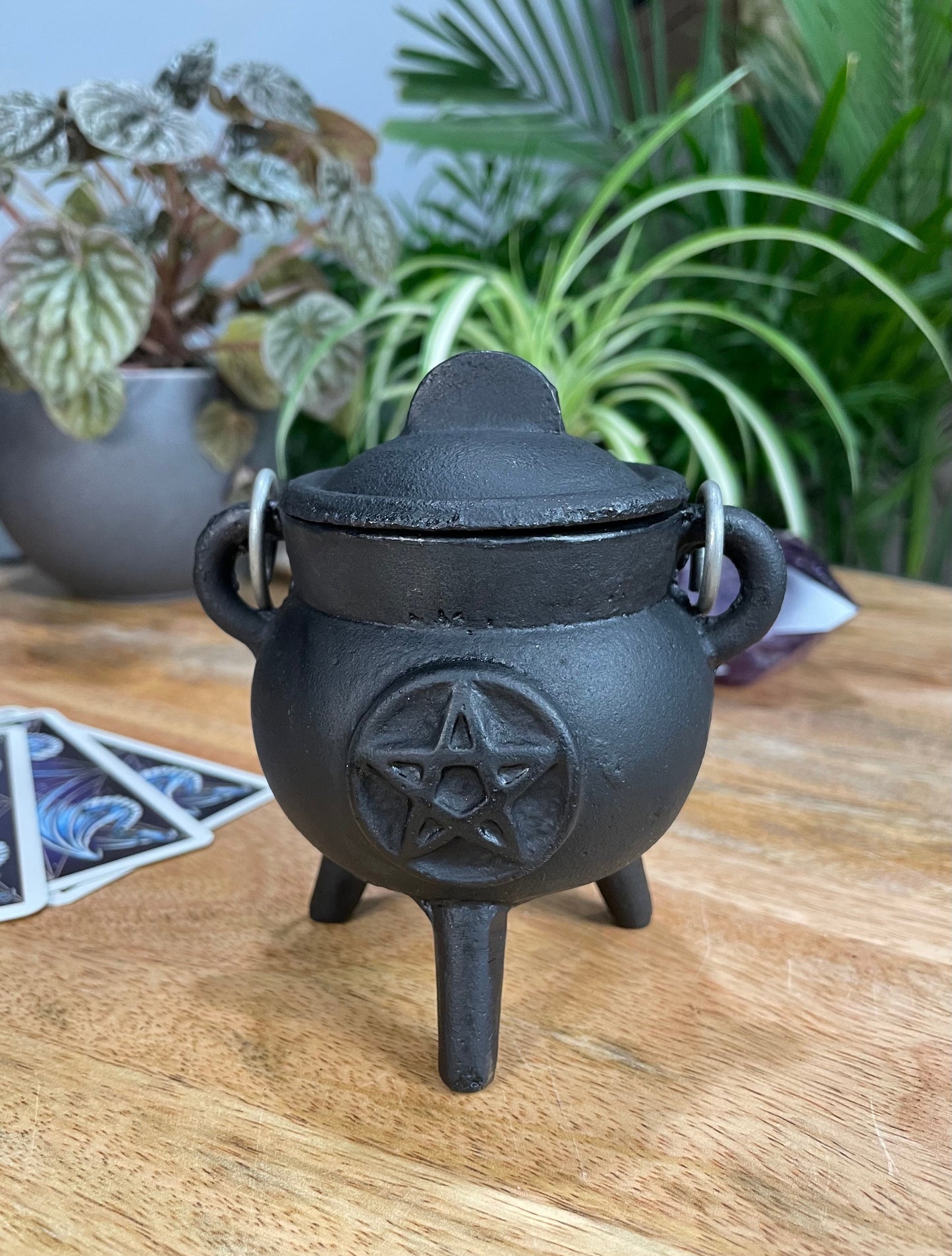 Pictured is a mini pentacle cast iron cauldron.
