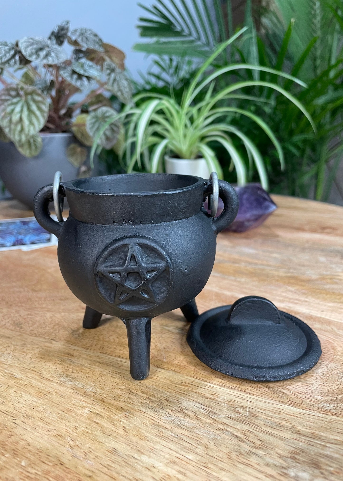 Pictured is a mini pentacle cast iron cauldron.