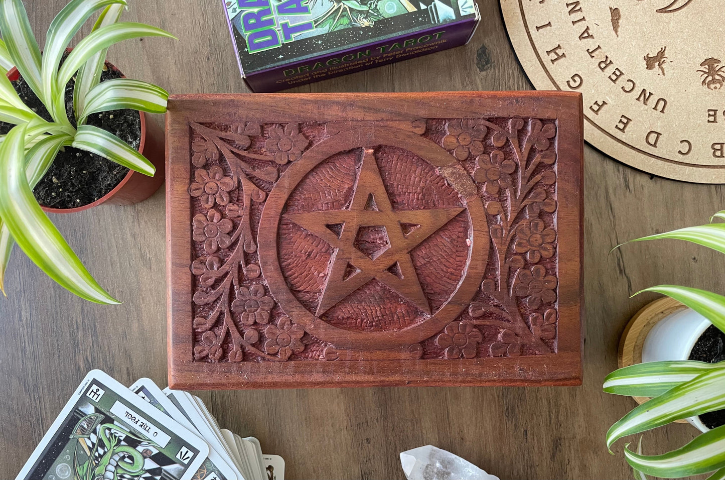Pictured is hand-carved wood box with the pentacle symbol in the middle.