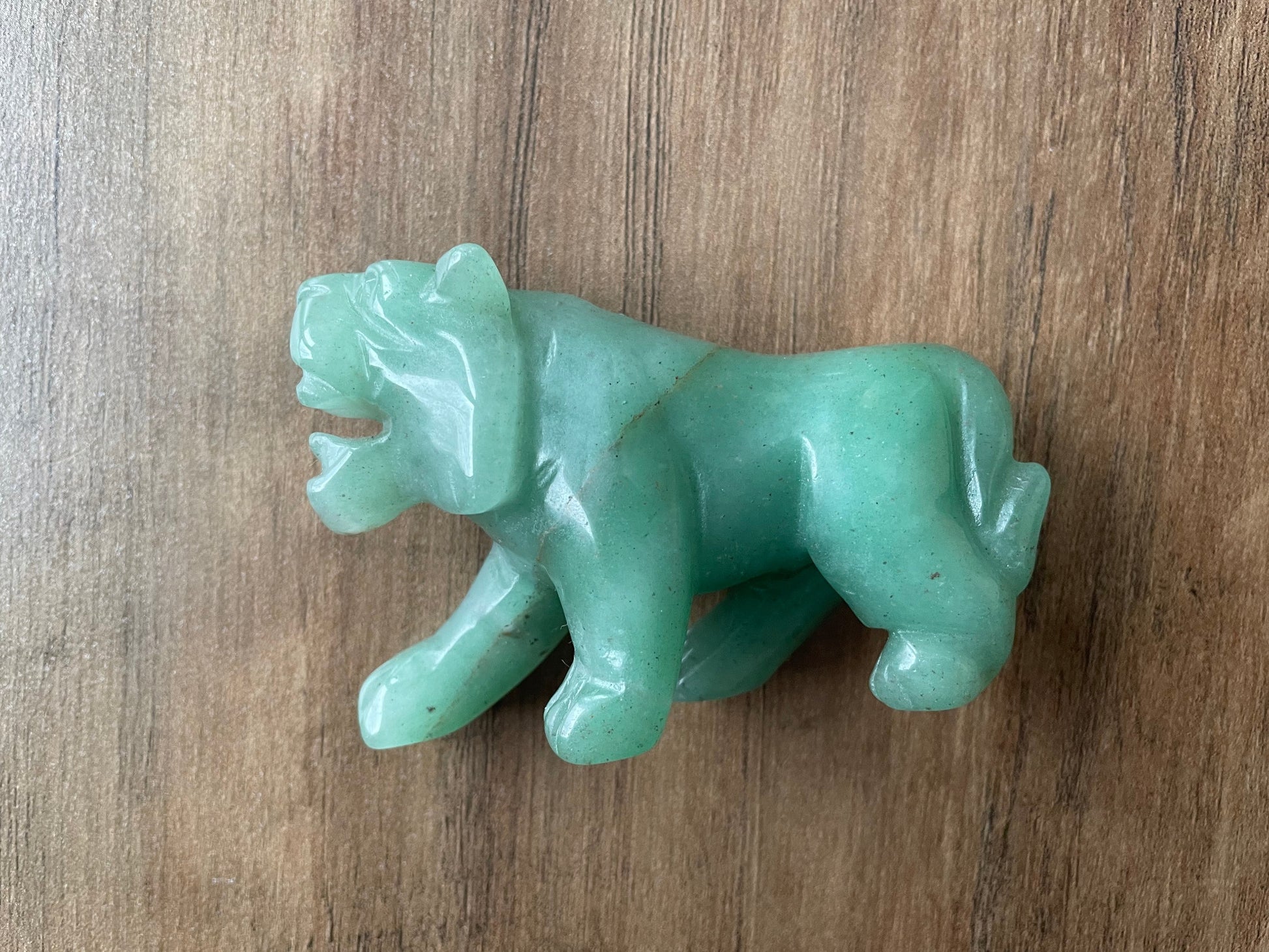 Pictured is a tiger carved out of green aventurine.