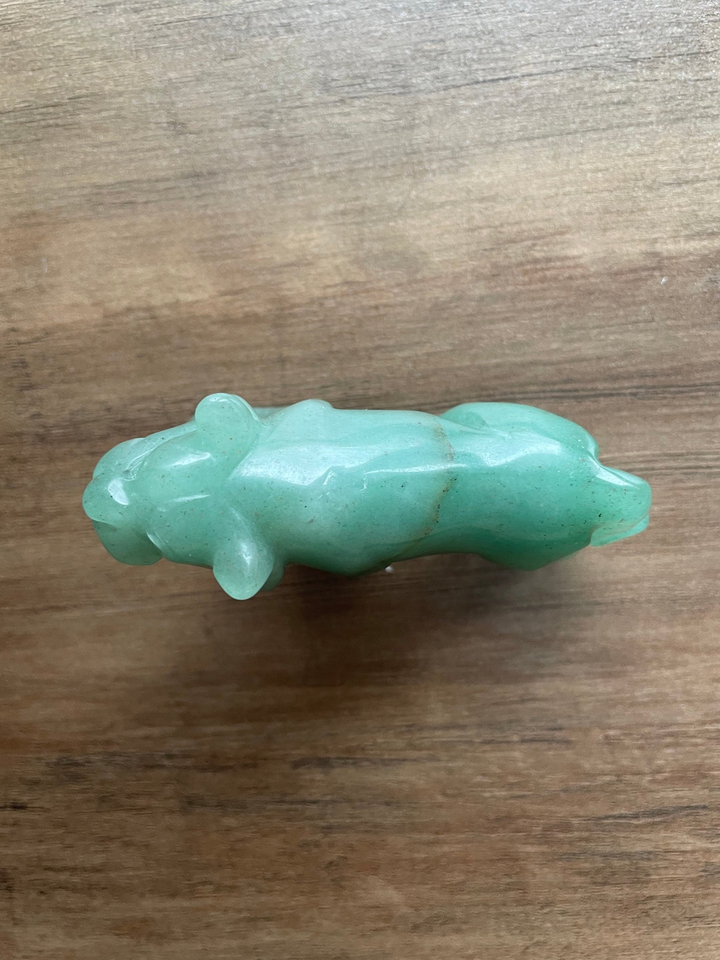Pictured is a tiger carved out of green aventurine.
