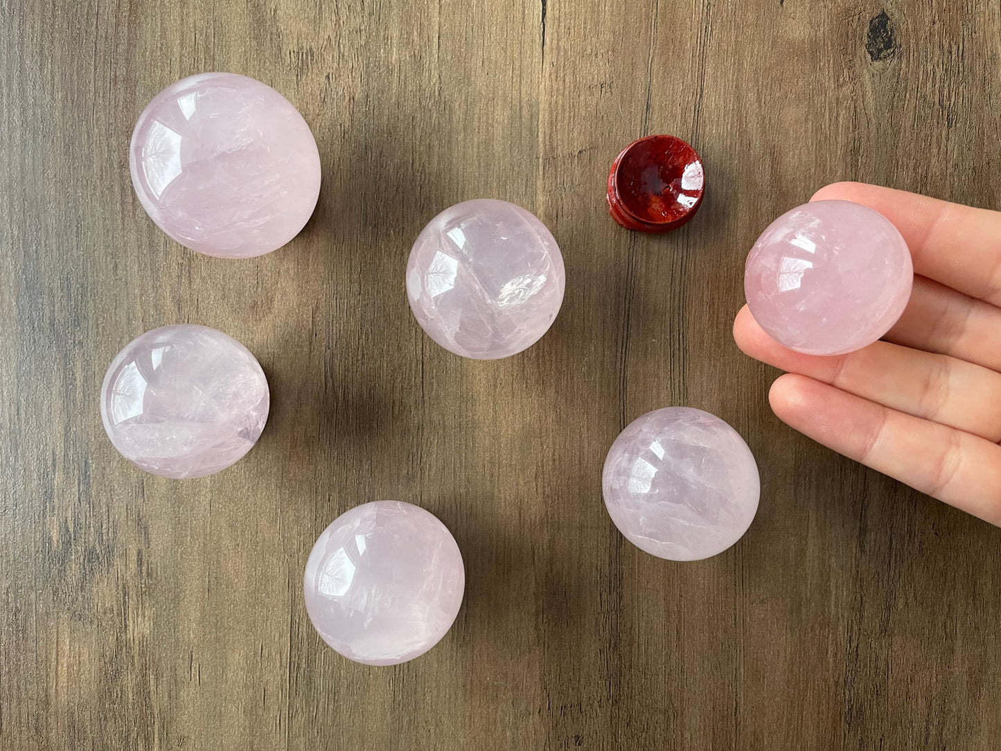 Pictured is a sphere carved out of rose quartz.