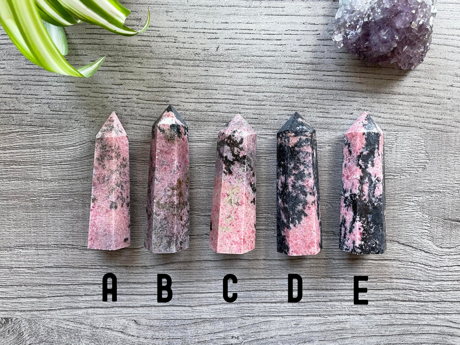 Pictured are various points of rhodonite.
