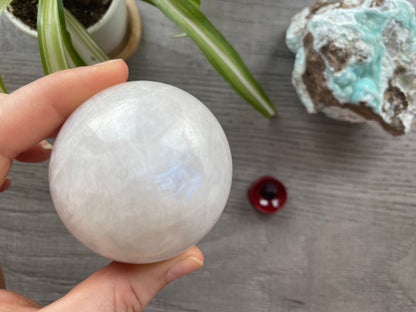 Pictured is a sphere carved out of white moonstone.