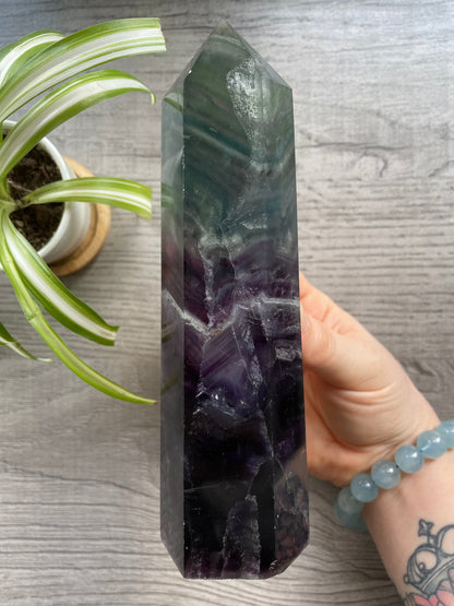 Pictured is a tower carved out of rainbow fluorite.