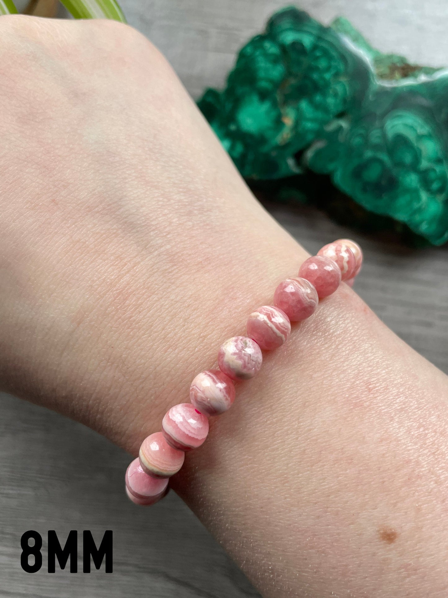 Pictured is a rhodochrosite bead bracelet.