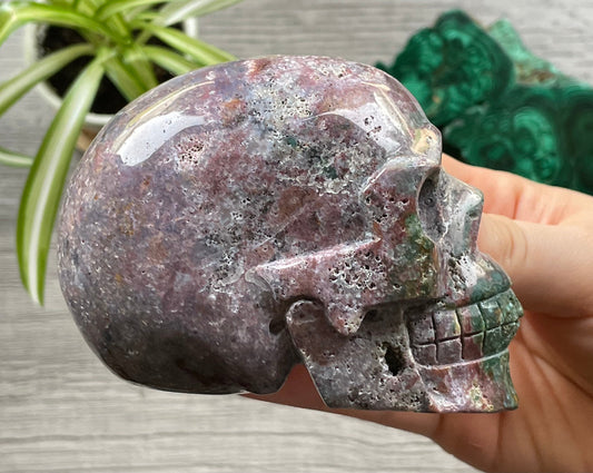 Pictured is a large skull carved out of ocean jasper or river jasper.