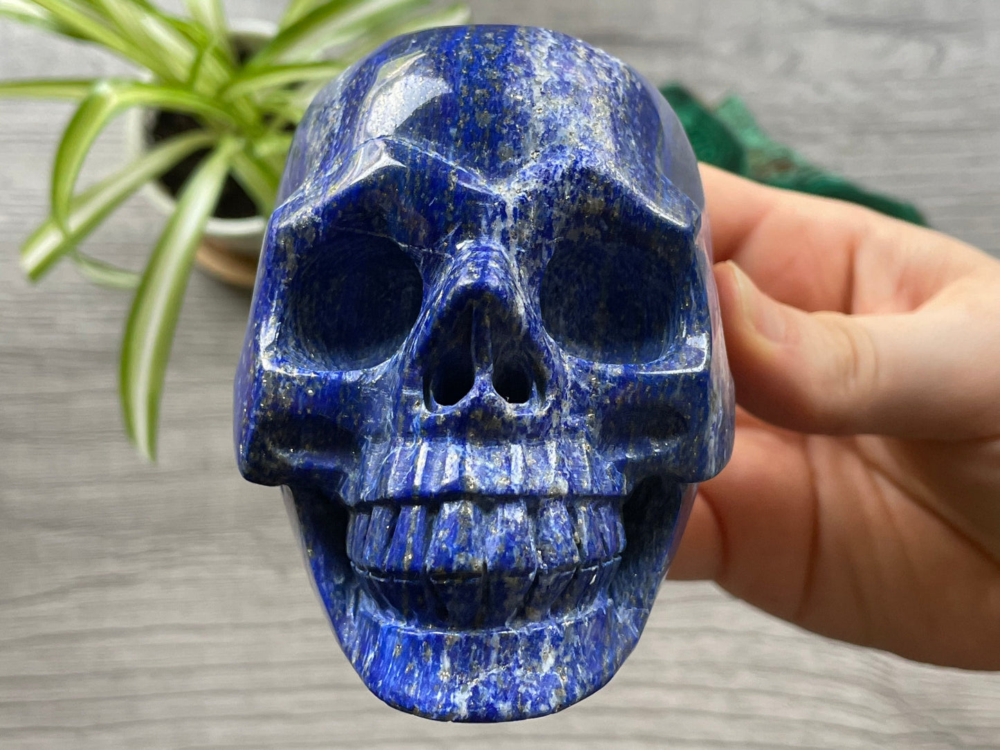 Pictured is a large skull carved out of lapis lazuli.