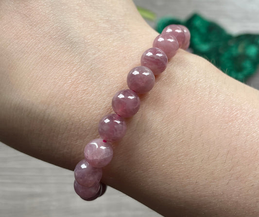 Pictured is a lavender rose quartz bracelet.
