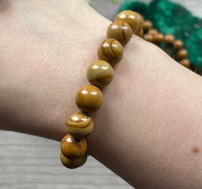 Pictured is a picture jasper bead bracelet.
