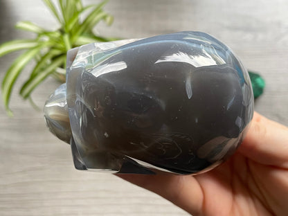 Pictured is a large skull carved out of druzy agate.