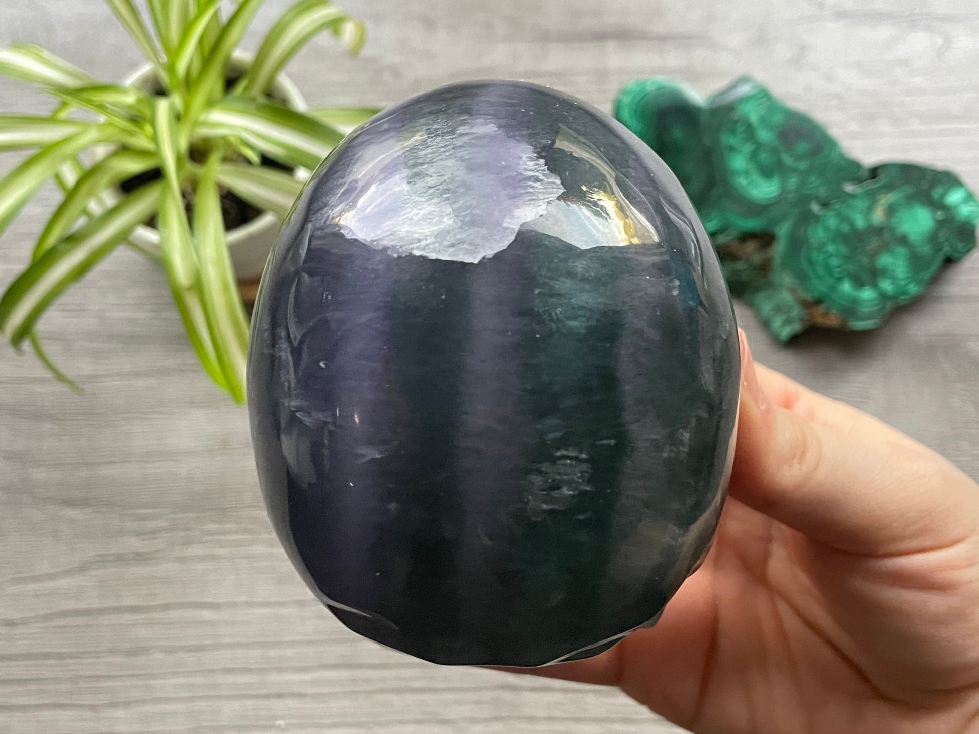 Pictured is a large skull carved out of rainbow fluorite.