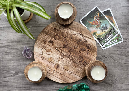 Pictured is a wood candle holder for three candles with a pentagram and the moon phases engraved on it.