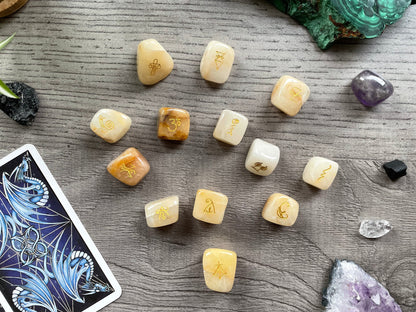 Pictured are reiki symbol stones carved out of golden healer tumbled crystals.
