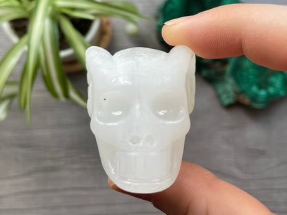 Pictured is a large skull carved out of white chalcedony.
