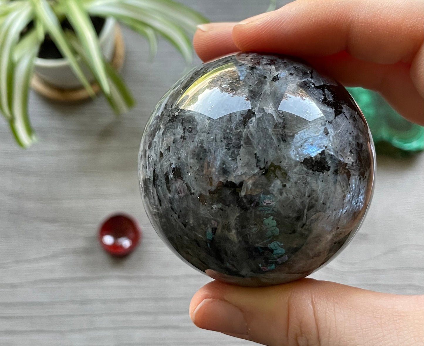 Pictured is a sphere carved out of larvikite.