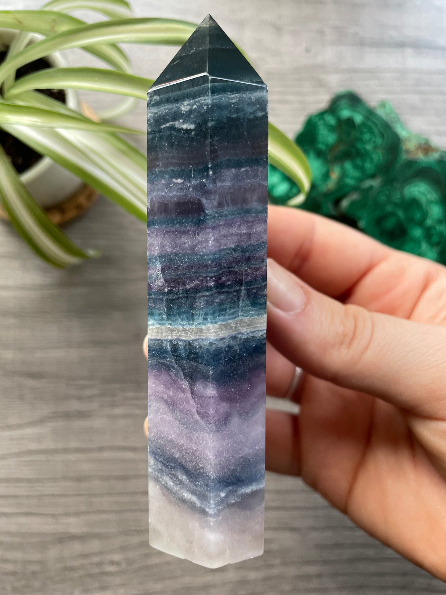 Pictured is a tower carved out of silky fluorite.