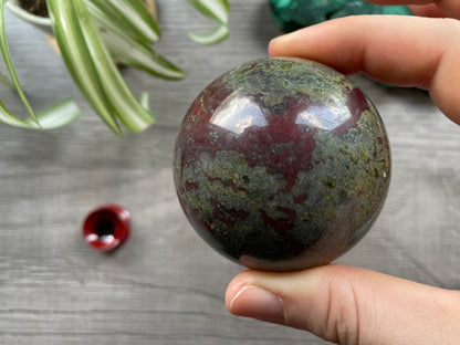 Pictured is a sphere carved out of dragon bloodstone.