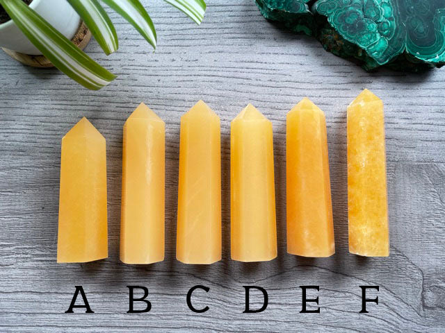 Pictured are various points of orange calcite.
