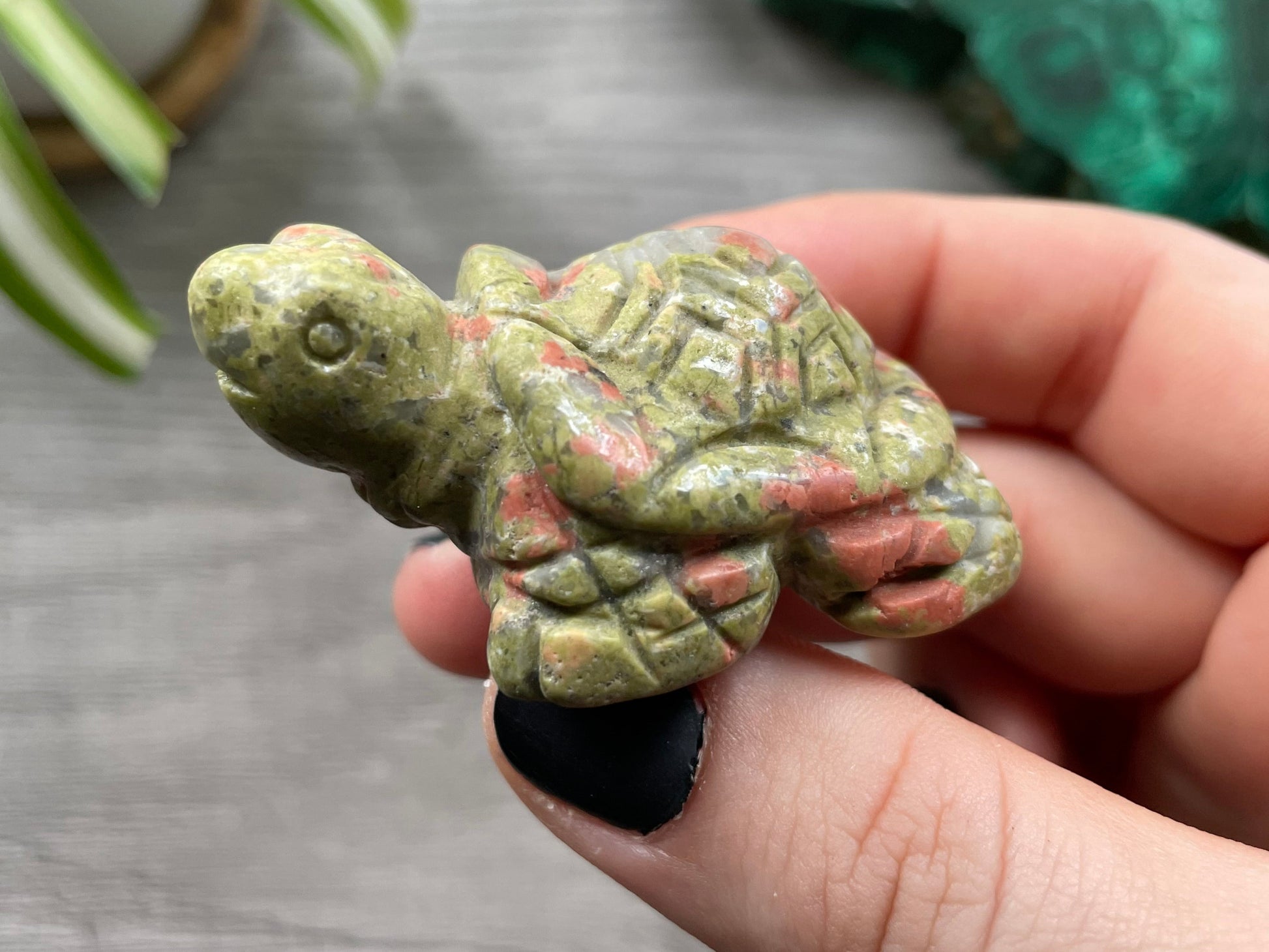 Pictured is a turtle carved out of unakite.