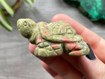 Pictured is a turtle carved out of unakite.
