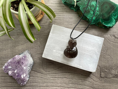 Pictured is a smoky quartz fox necklace.