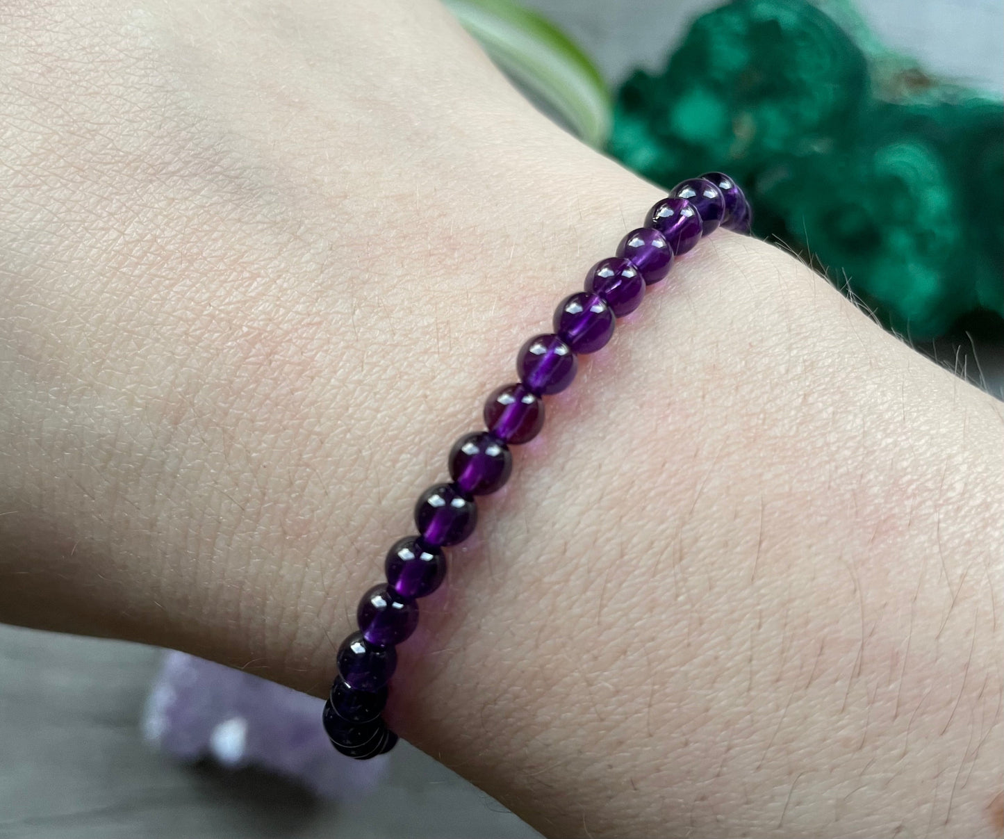 Pictured is an amethyst bead bracelet.