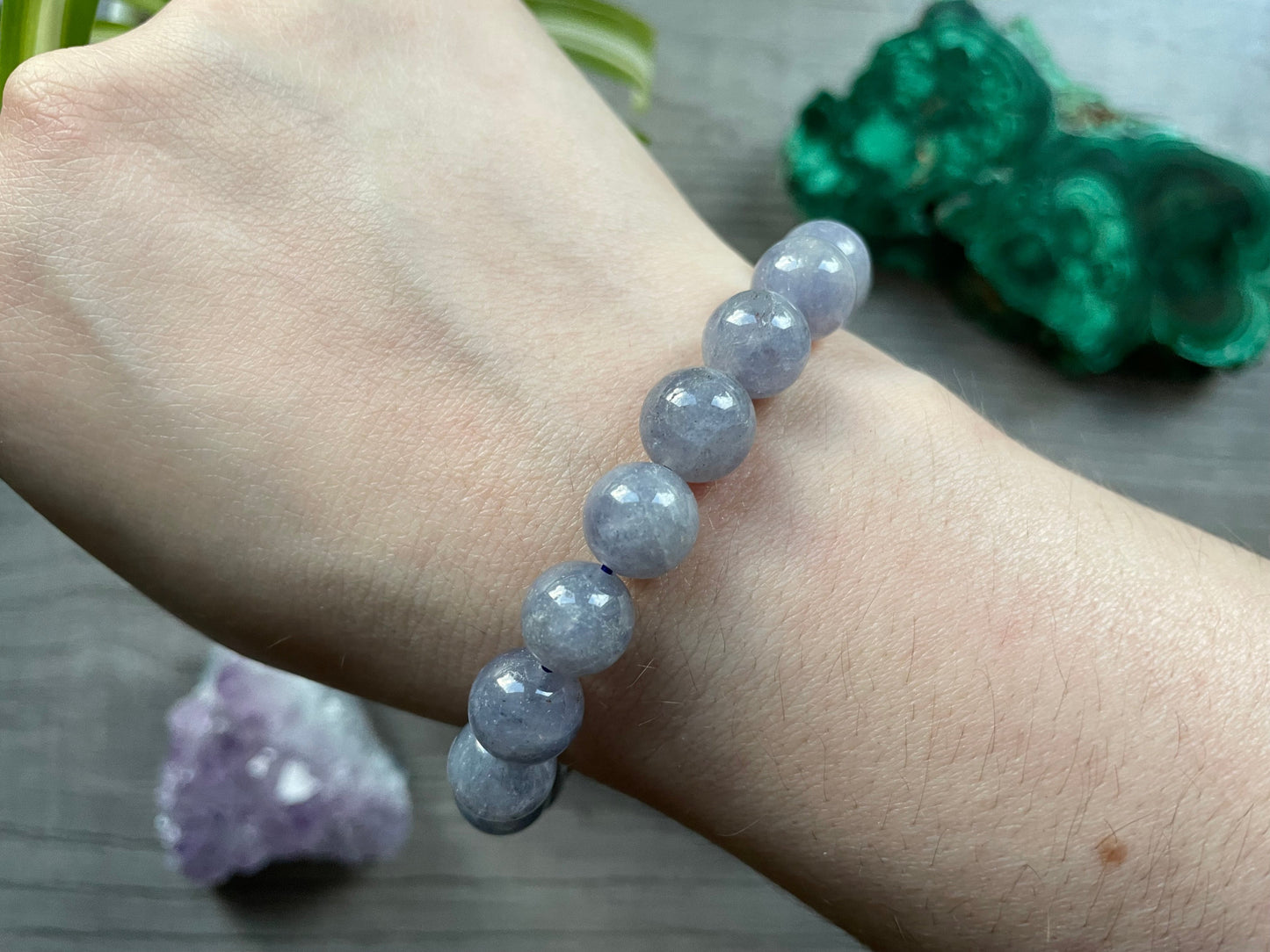 Pictured is a iolite bead bracelet.