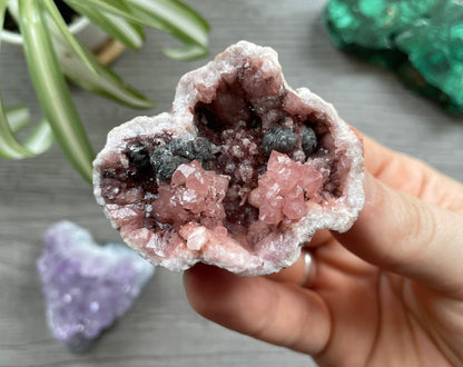 Pictured is a pink amethyst geode.