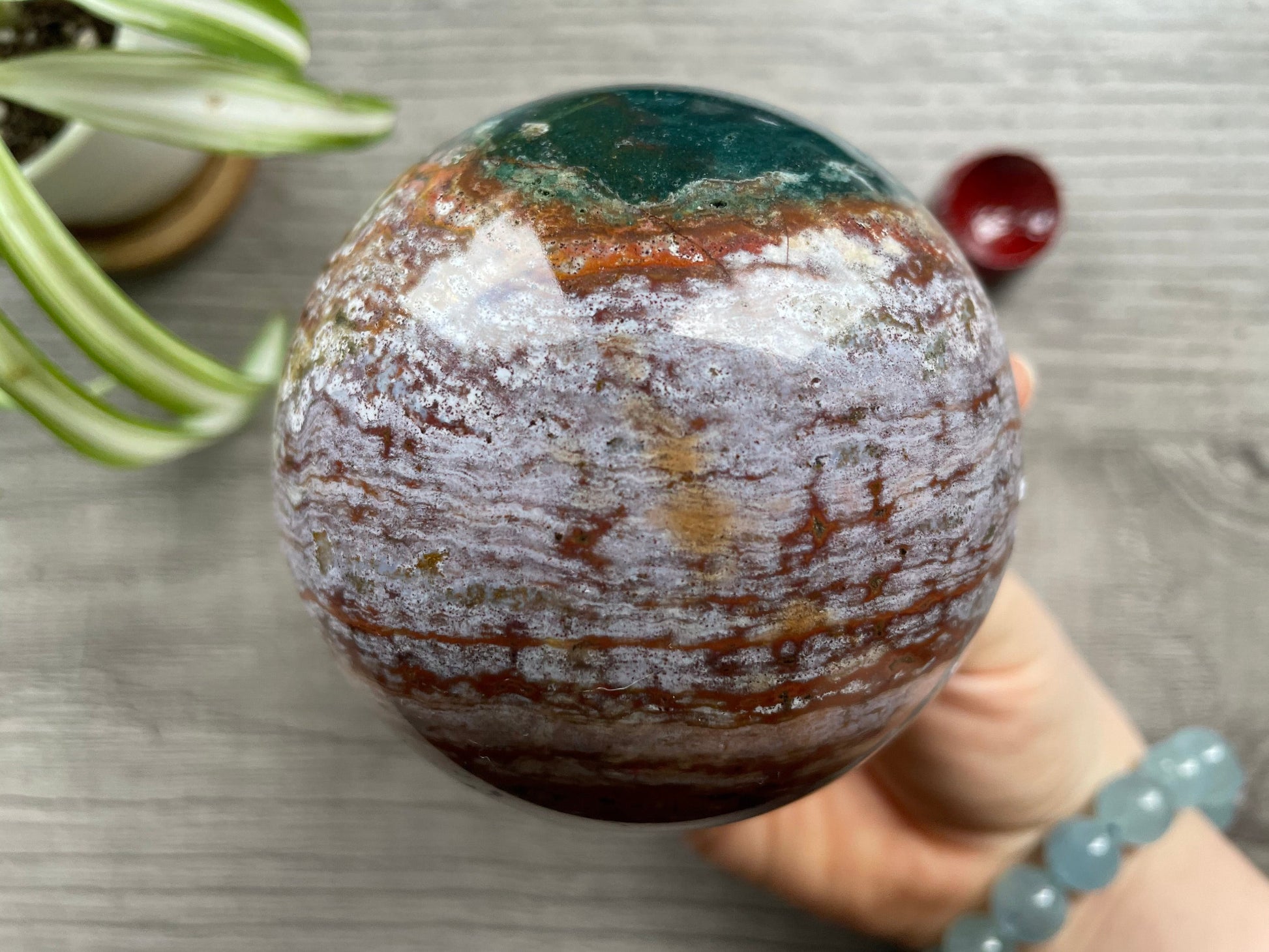Pictured is a sphere carved out of ocean jasper / river jasper.