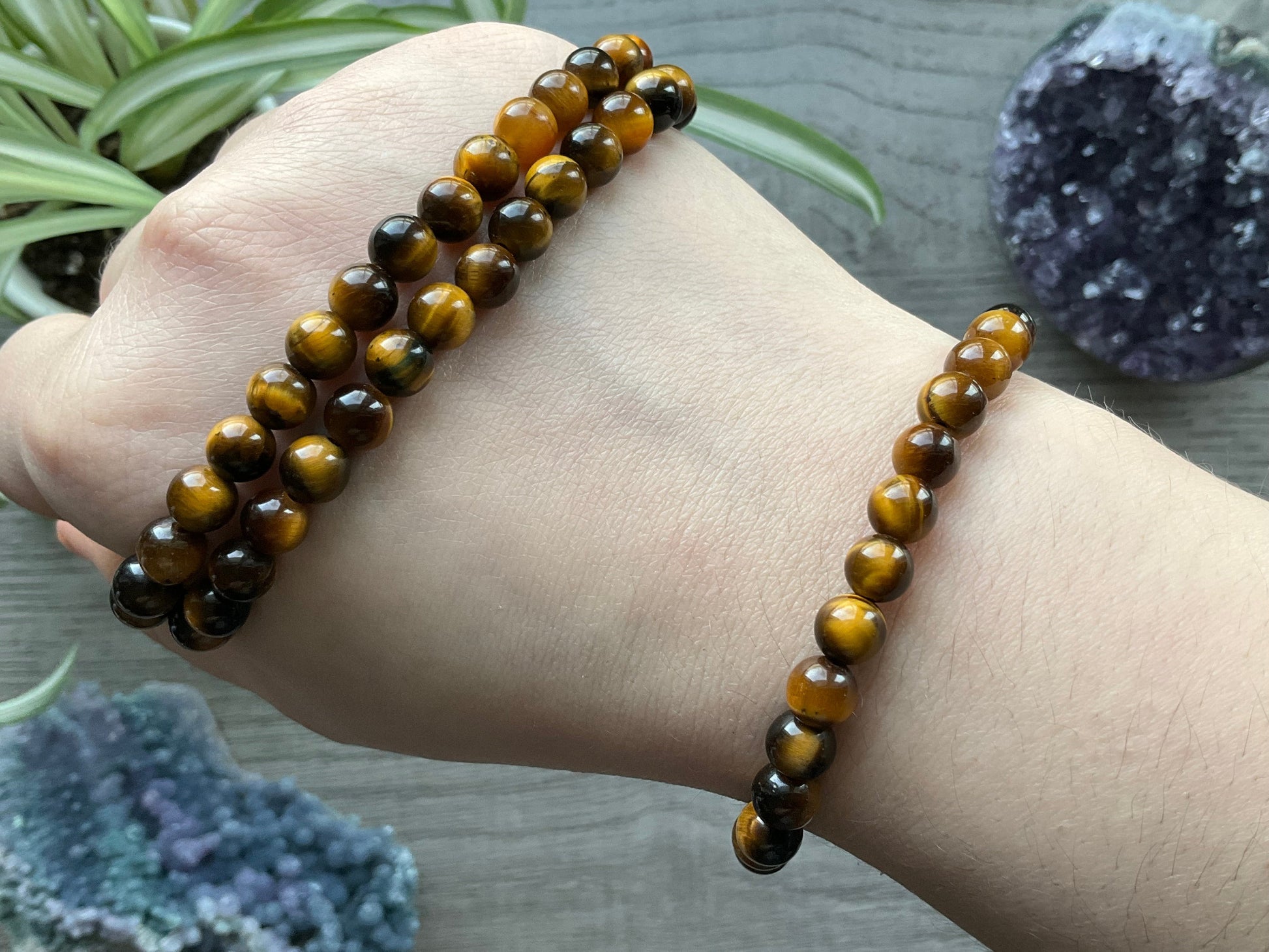 Pictured is a yellow tiger's eye bead bracelet.