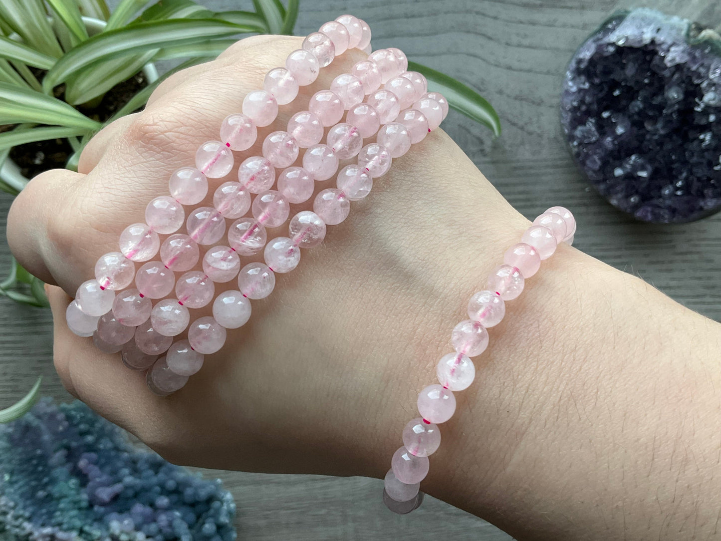 Pictured is a rose quartz bead bracelet.