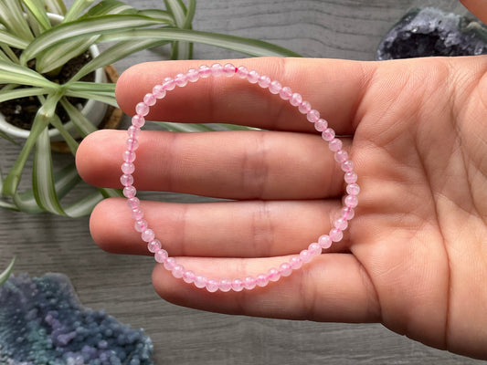 Pictured is a rose quartz bead bracelet.
