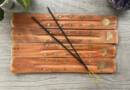Pictured are various wood and brass inlay incense stick holders.