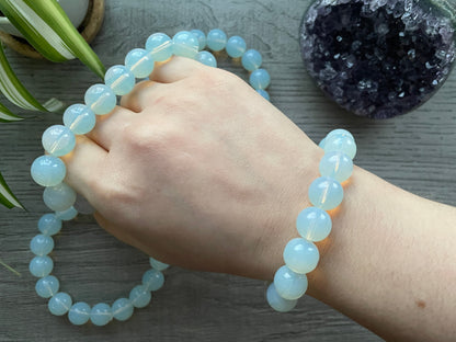 Pictured is a opalite bead bracelet.