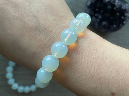 Pictured is a opalite bead bracelet.