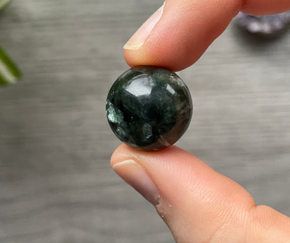 Pictured is a sphere carved out of seraphinite.