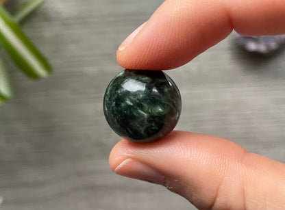 Pictured is a sphere carved out of seraphinite.