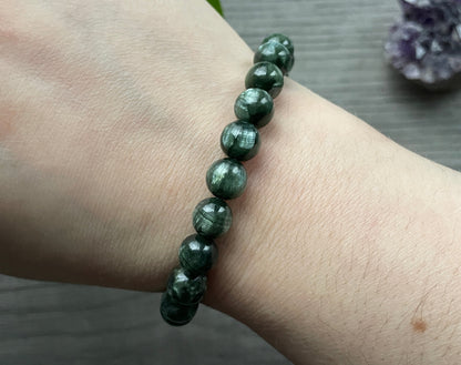 Pictured is a seraphinite bead bracelet.