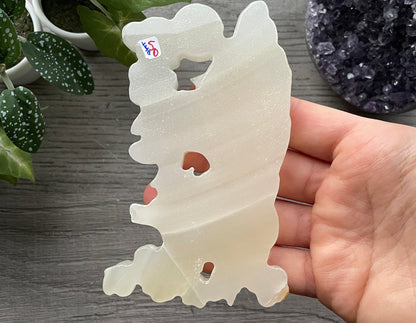 Pictured is a nine-tailed fox carved out of white chalcedony.