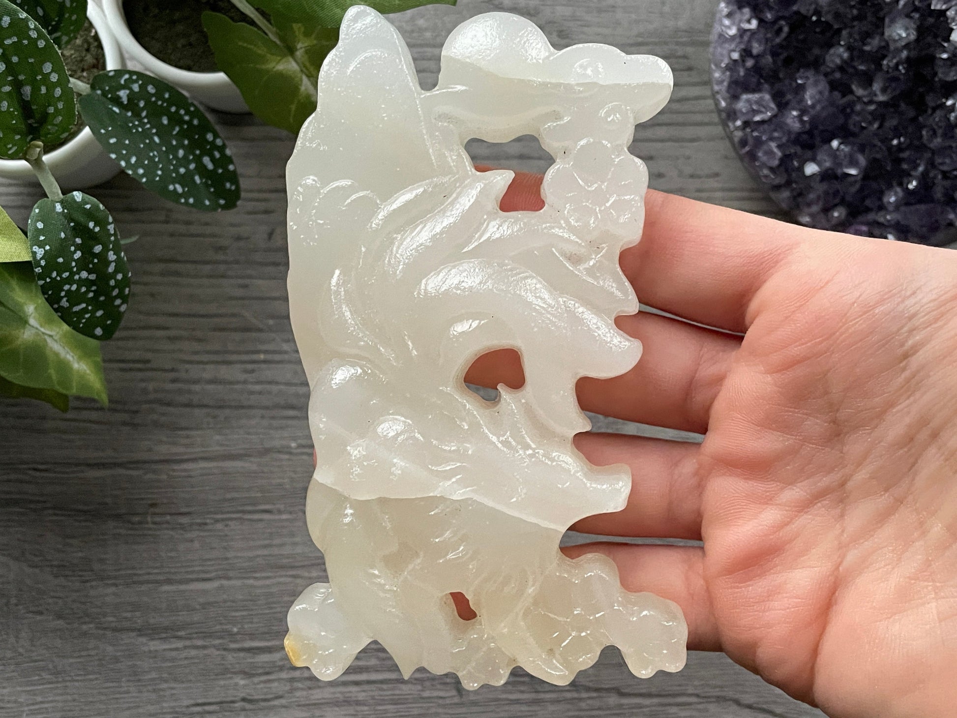 Pictured is a nine-tailed fox carved out of white chalcedony.