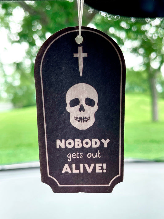 Pictured is an air freshener in the shape of a tombstone