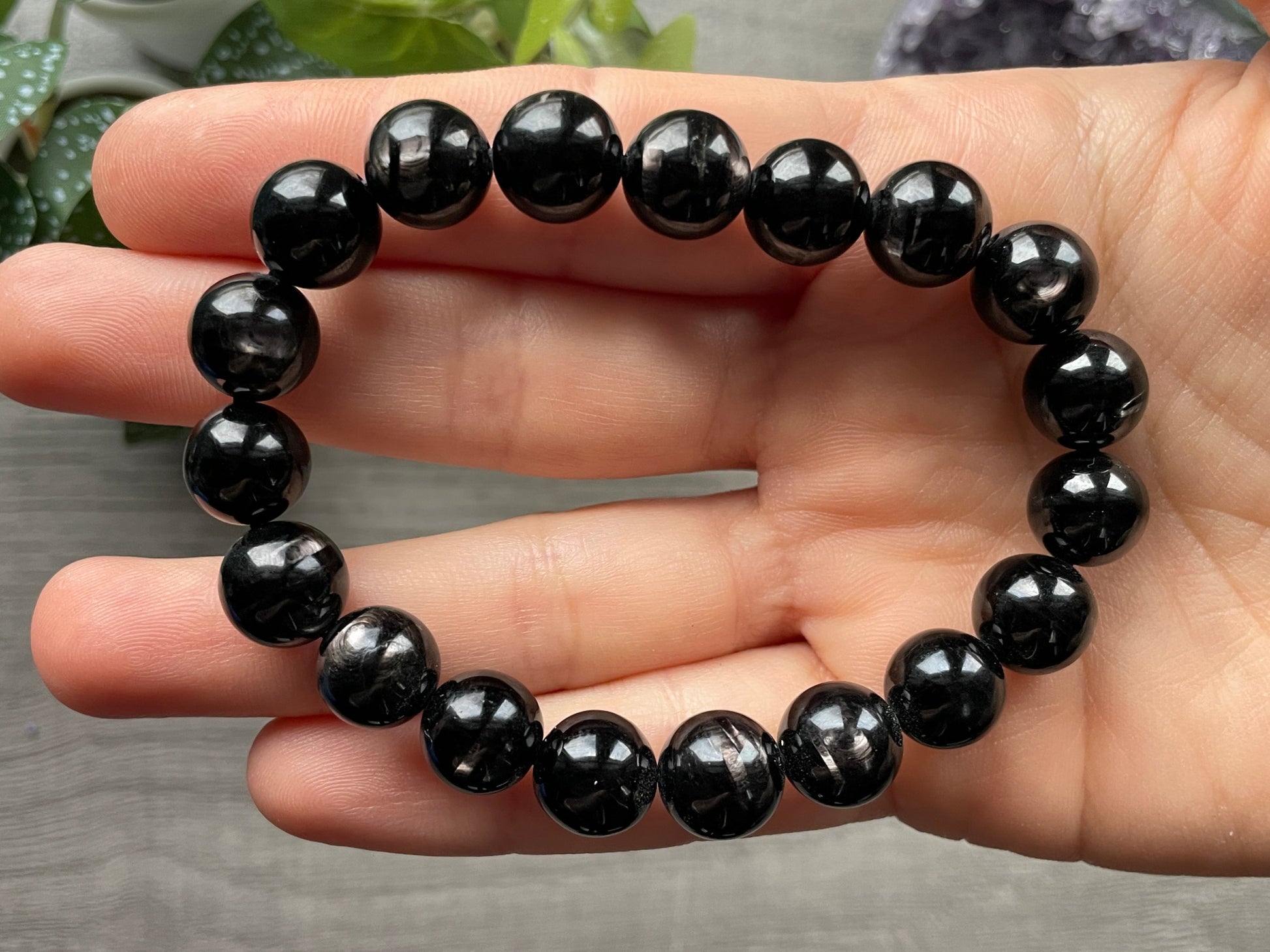 Pictured is a hypersthene bead bracelet.