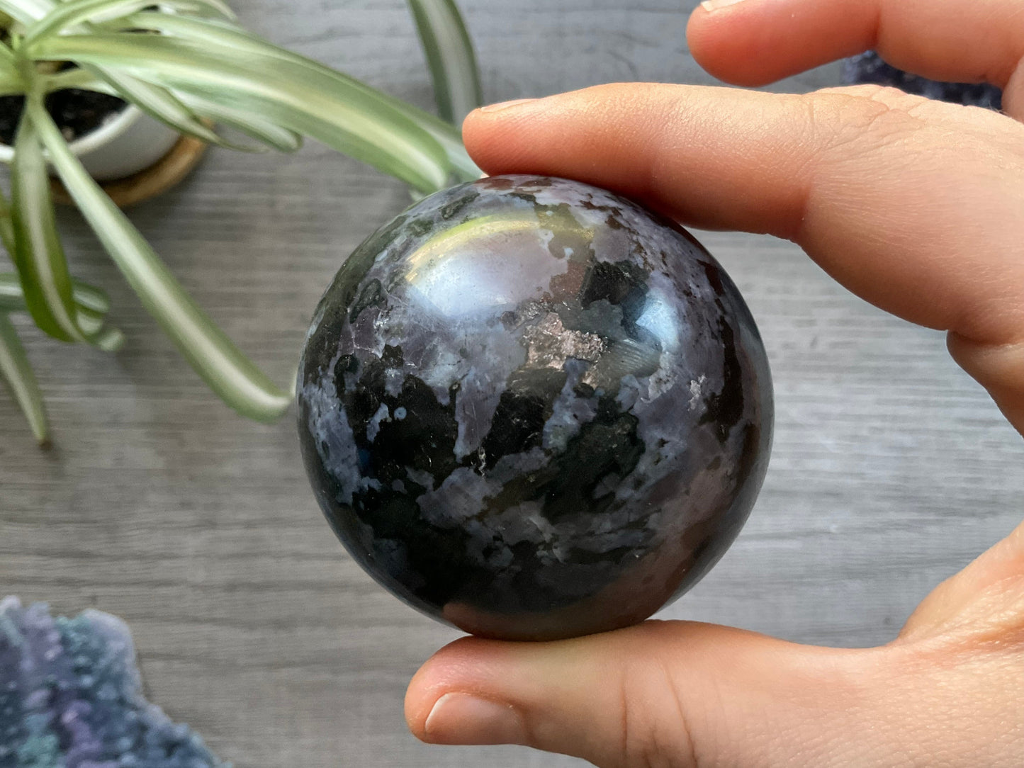 Pictured is a sphere carved out of indigo gabbro (mystic merlinite). 
