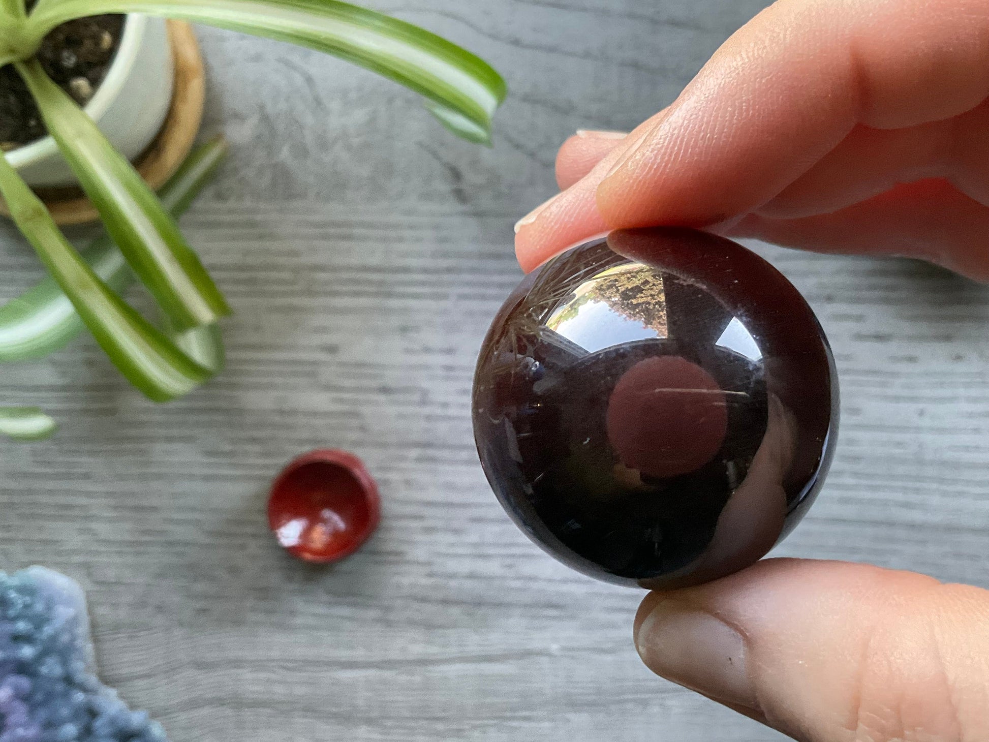 Pictured is a sphere carved out of red tiger's eye.