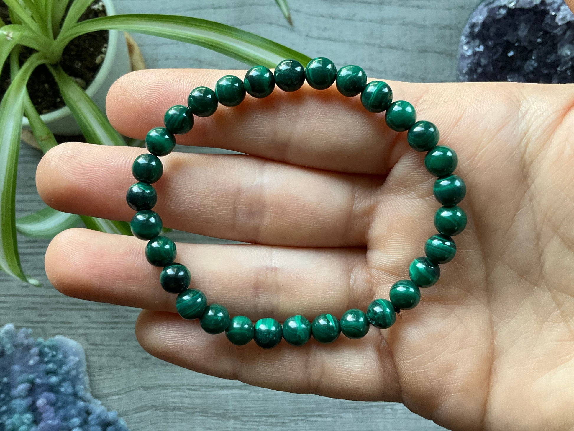 Pictured is a malachite bead bracelet.