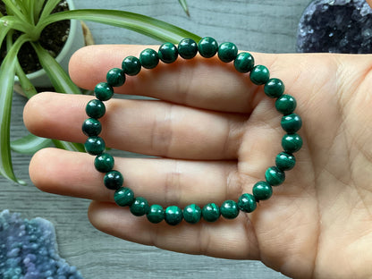 Pictured is a malachite bead bracelet.