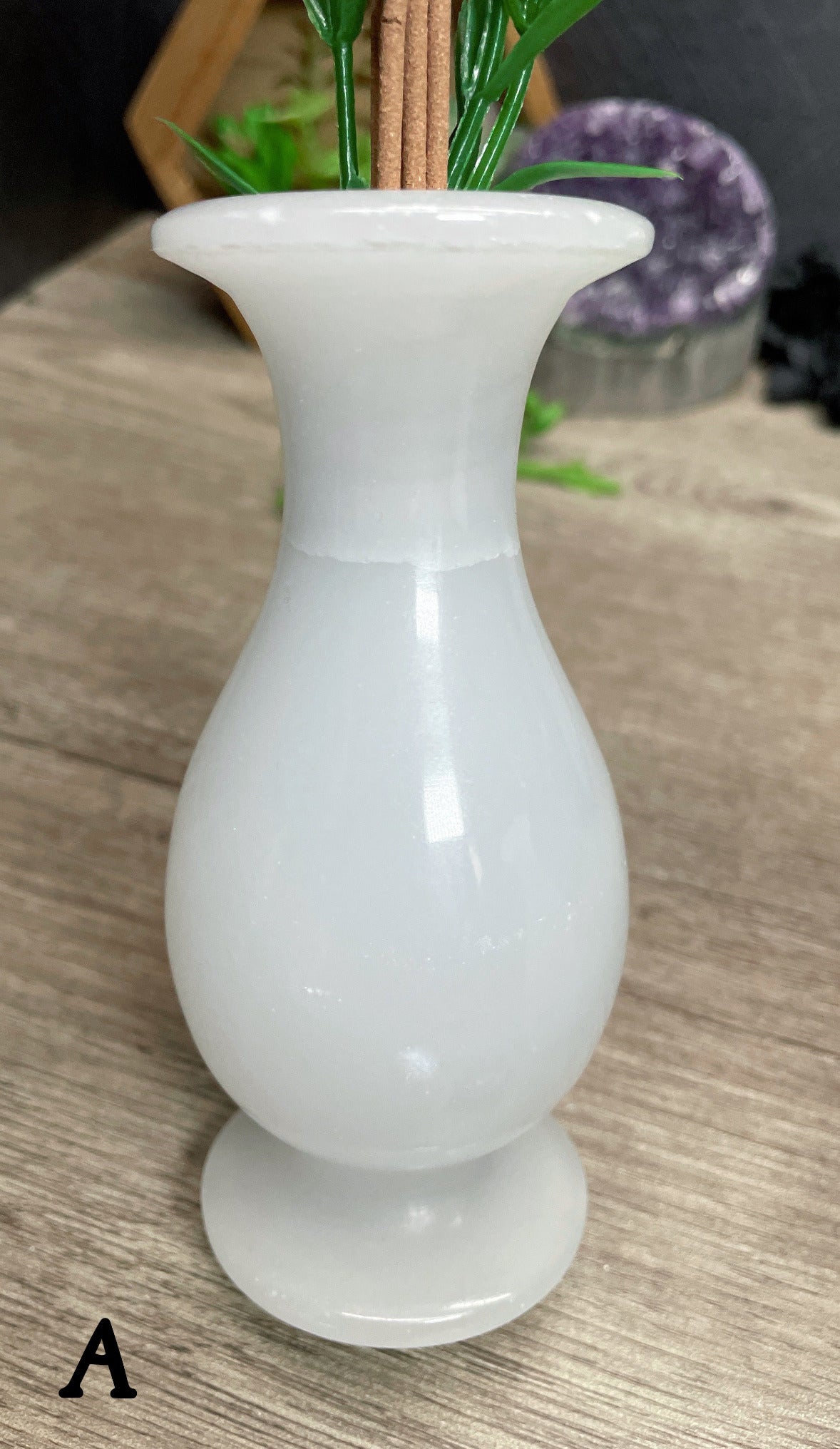 Pictured is a vase carved out of white marble.